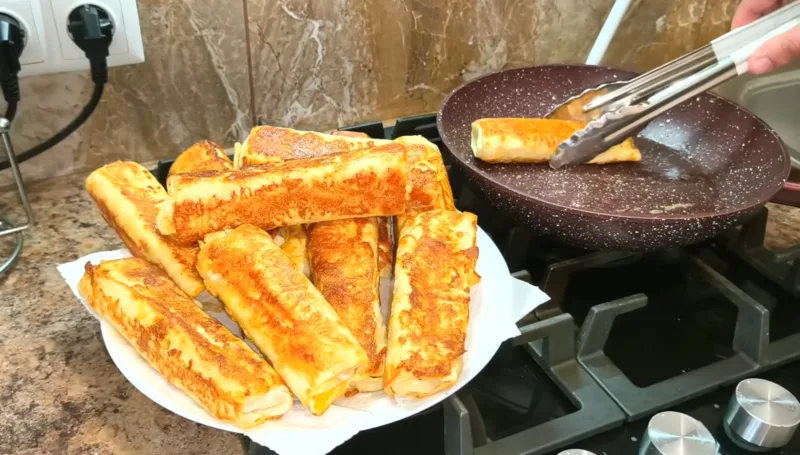Хрусткі рулетики з лаваша з грибами, перцем і сиром